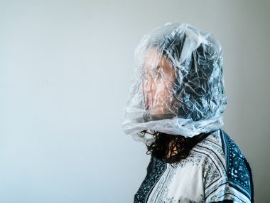 woman with plastic bag over her head